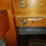 Close-up dowel hole in bed frame